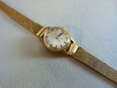 A LADIES YELLOW GOLD WRISTWATCH, the round dial inscribed "Certina", attached to an 18ct yellow gold