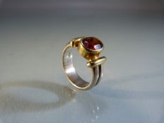 Silver ring set with garnet