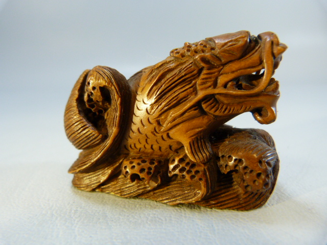 Carved wooden Netsuke of a dragon among water - Image 3 of 6