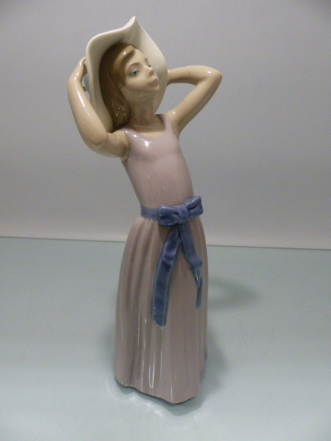 Lladro - figure of a girl holding her hat