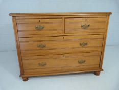 Satinwood chest of four drawers with swan neck handles