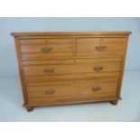 Satinwood chest of four drawers with swan neck handles