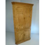 Antique pine corner cabinet with doors over