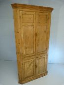 Antique pine corner cabinet with doors over