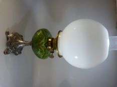 Art Nouveau oil lamp with green glass well on a silver coloured base