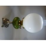 Art Nouveau oil lamp with green glass well on a silver coloured base