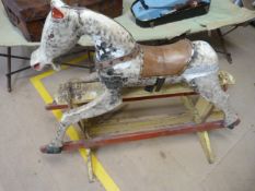 Early wooden dapple grey rocking horse (unmarked). On painted base. Large naive head with open