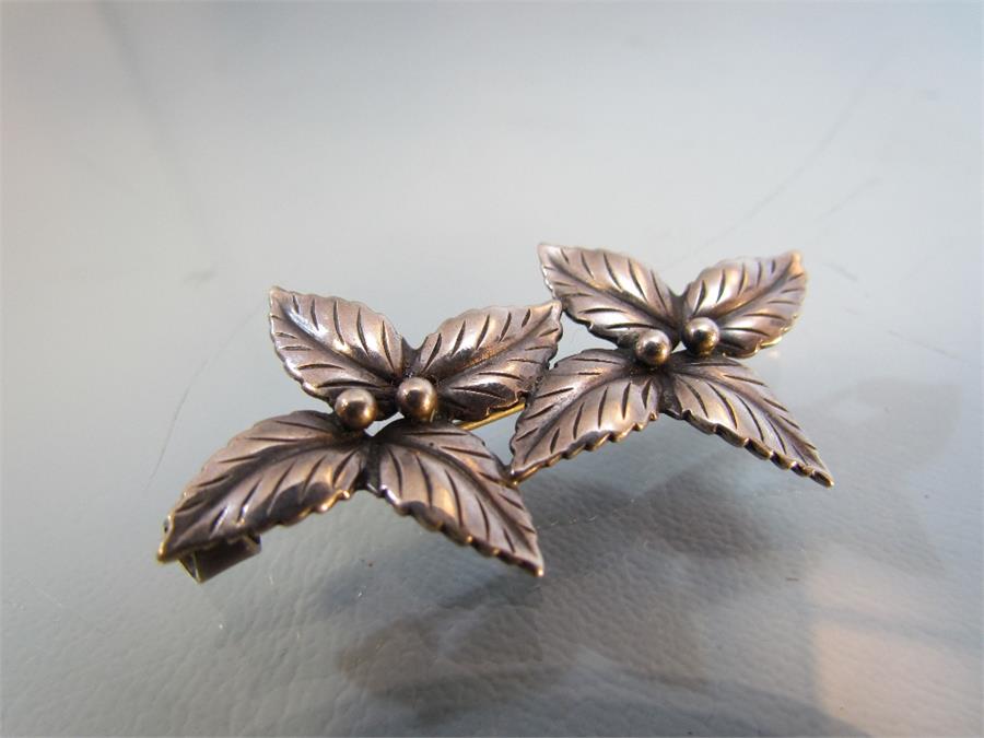 Two silver brooches - 1) Marked DENMARK JOHN L Sterling on the 'C' clasp this double leaf flower - Image 3 of 5