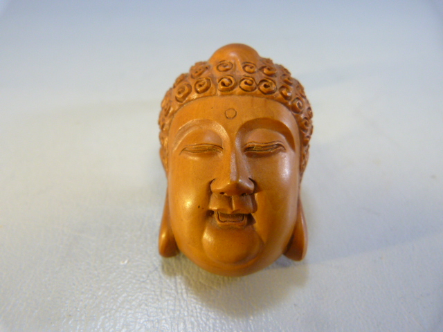 Wooden Netsuke of a Buddhist head