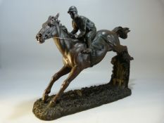 RACING - Large bronzed resin figure of a Point to Point horse and rider.