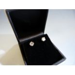 Pair of 14ct white gold diamond stud earrings of approx 1.1pts