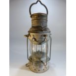 Metal ships lamp with brass label 'Anchor'