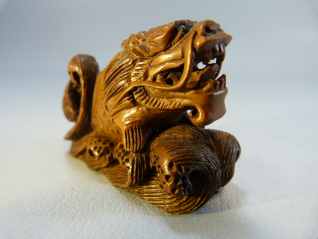 Carved wooden Netsuke of a dragon among water - Image 5 of 6