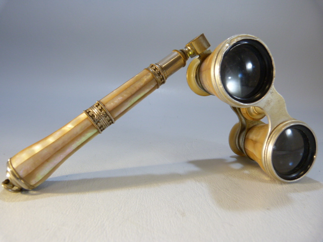 Pair of Mother of Pearl opera Glasses with filigree and mother of pearl handle.