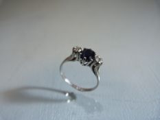 9ct white Gold Sapphire and Diamond 3 stone Trilogy Ring. The centre oval Sapphire is approx: 6.