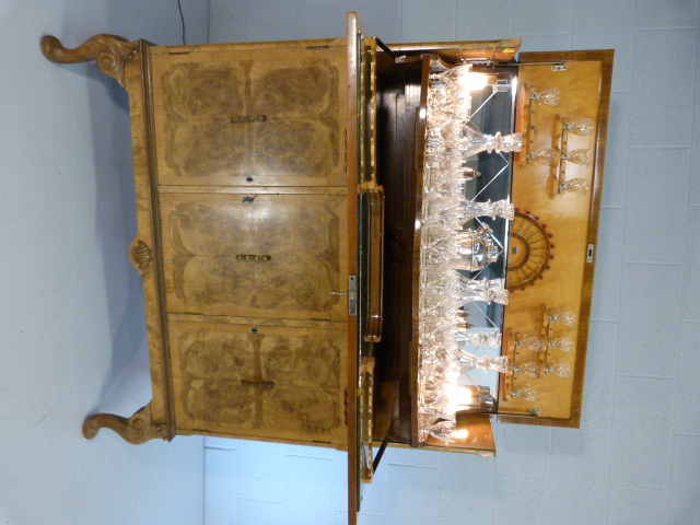 Art Deco walnut cocktail cabinet with drop front above two cupboards. Opens to reveal mirrored light - Image 2 of 25