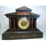 A French black slate and marble mantle clock, the circular dial with enamelled chapter ring with