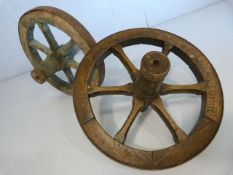 Two small vintage oak and metal bound cart wheels