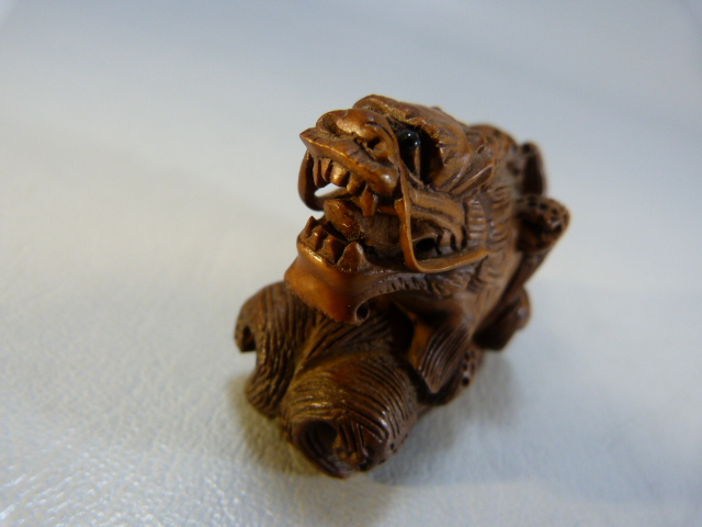 Carved wooden Netsuke of a dragon among water - Image 4 of 6