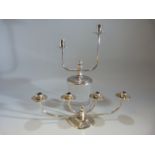 A pair of plated candlesticks of classic Danish design the four branch by Berg of Denmark and the