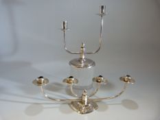 A pair of plated candlesticks of classic Danish design the four branch by Berg of Denmark and the