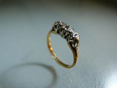 18ct Gold and Platinum ladies ring set with three diamonds. Size K