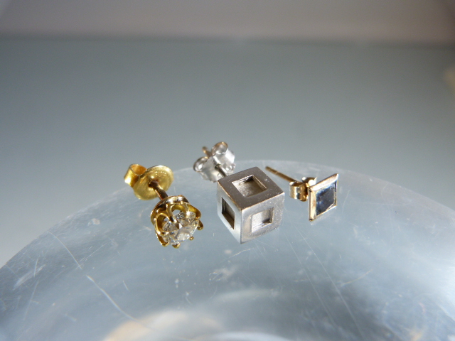 3 x Single Earrings: (1) ½ carat clean Brilliant cut Diamond. (2) Silver (925) approx: 6.4 cube. (3)