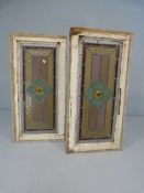 Two stained glass windows with amber knop to middle