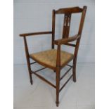 Antique turned wooden chair with stick stretchers and open arms