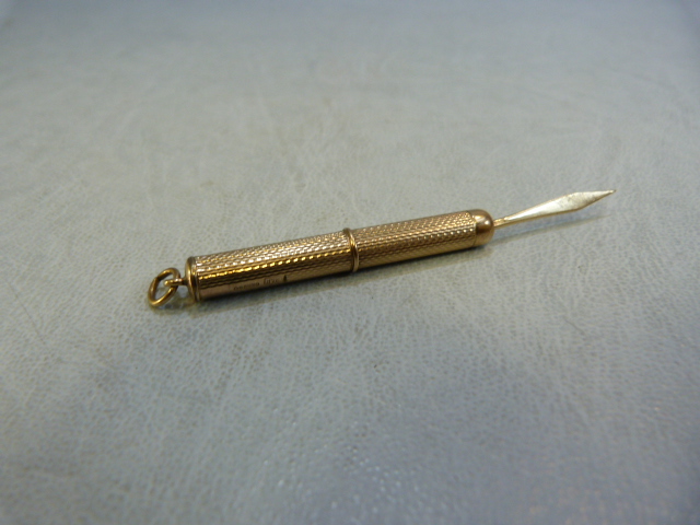 A 9ct gold propelling tooth pick, 5.7g maker R&R