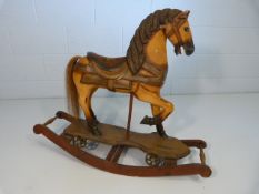 Folk Art wooden rocking horse with painted saddle and horse hair tail. Originally on cast iron