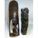 Two pieces of African Tribal art - one in the style of a Totem pole and a hanging wall plaque.