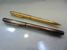 Hallmarked silver pen London by A Haviland-Nye 2005. Along with a gold coloured Waterman pencil