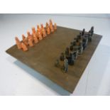 Middle eastern bronze patina-ted chess game complete with figures