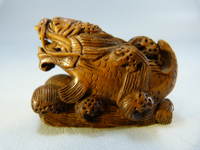 Carved wooden Netsuke of a dragon among water - Image 2 of 6