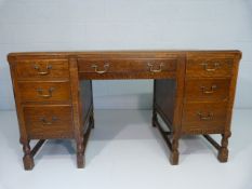 Oak pedestal desk with H-Stretchers to block feet inlay with green leather top