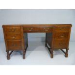 Oak pedestal desk with H-Stretchers to block feet inlay with green leather top