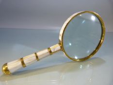 Brass and mother of pearl-handled magnifying glass