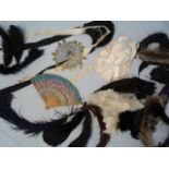 Selection of Ostrich Dress feathers, fan and a Middle Eastern headdress adorned with coins on a gold