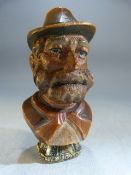 Carved wooden bust of a man with hat, underside a later addition is a gold coloured metal Georgian