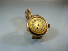 Ladies 9ct gold cased circular dress watch with expanding bracelt by J.H.W "9ct Gold /Metal