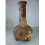 Central American early pottery 'Bottle' vase on Tripod feet. Circular and geometric patterns.