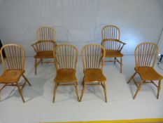 Set of six modern Windsor dining room chairs in elm each having stick back. Two carvers with