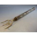 Silver handled toasting fork - the large silver handle with banded decoration and floral swags.