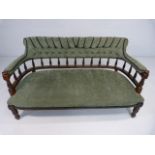 Early Victorian mahogany sofa with turned wooden Galleried back and later upholstery.