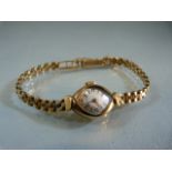 A lady's Avia 9ct gold cased wristwatch with 9ct gold bracelet, total weight approx 14.3g