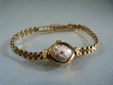 A lady's Avia 9ct gold cased wristwatch with 9ct gold bracelet, total weight approx 14.3g