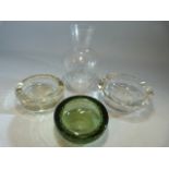 Two whitefriars bubble encased glass ashtrays and one other along with a bulbous shaped decanter