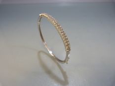 Silver bangle with double row of CZ