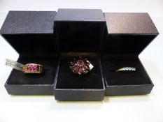 Three sterling silver rings in boxes
